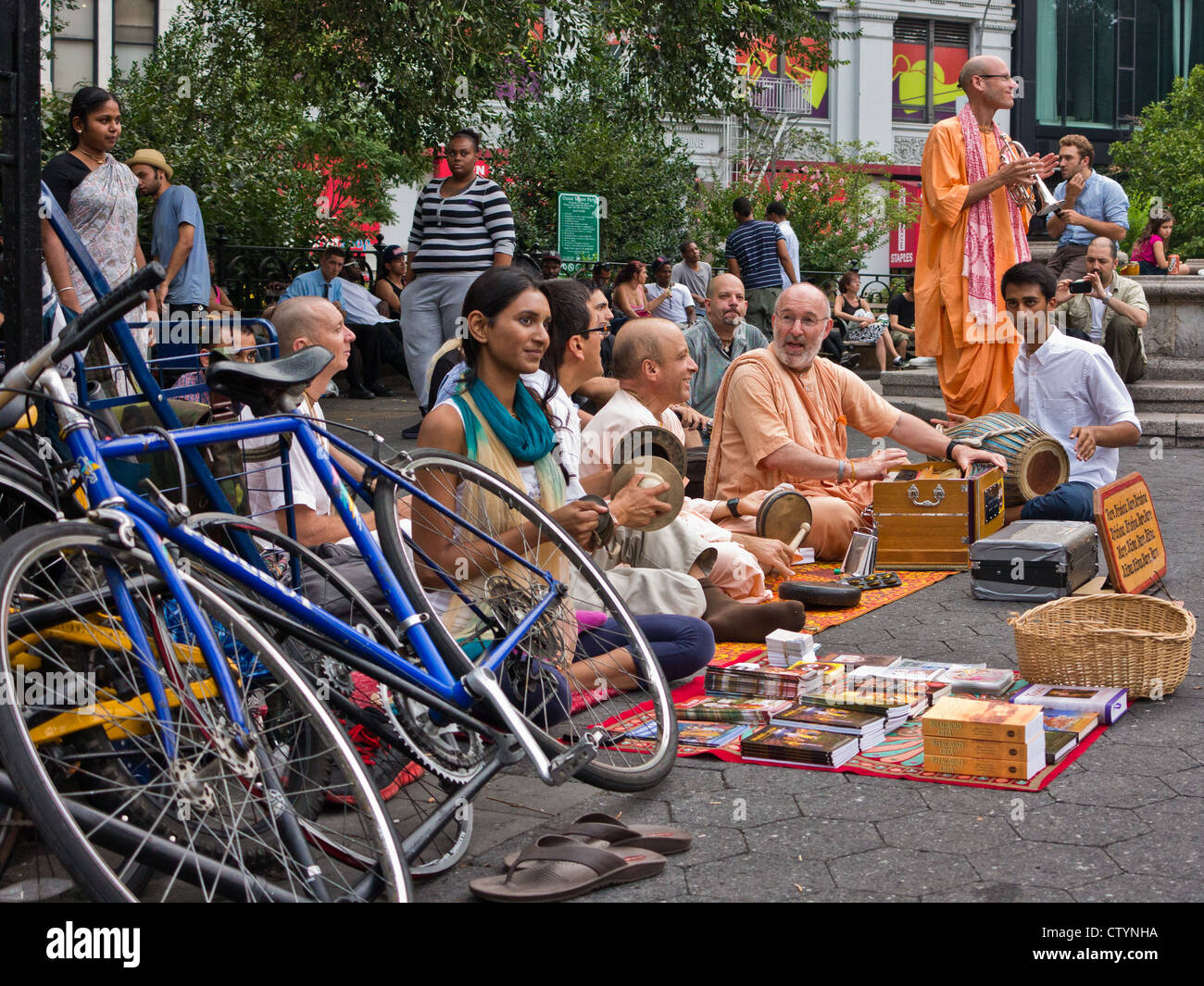 Members of the Hare Krishna movement congregate for song and recitation at Union Square, Manhattan. New York, New York, USA. Stock Photo