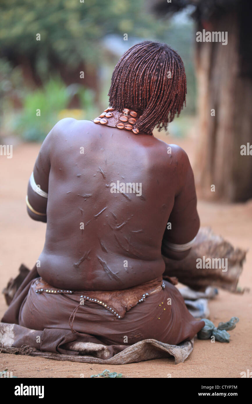 Tribal woman with scars on her back, Omo valley Ethiopia Stock Photo