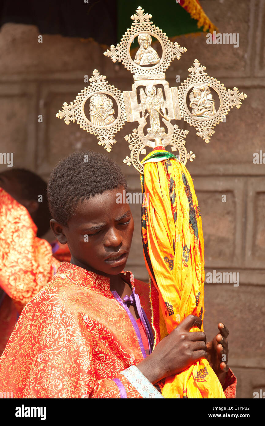 Young priest with Ethiopian cross at a religious procession, in Ethiopia, Africa. Stock Photo