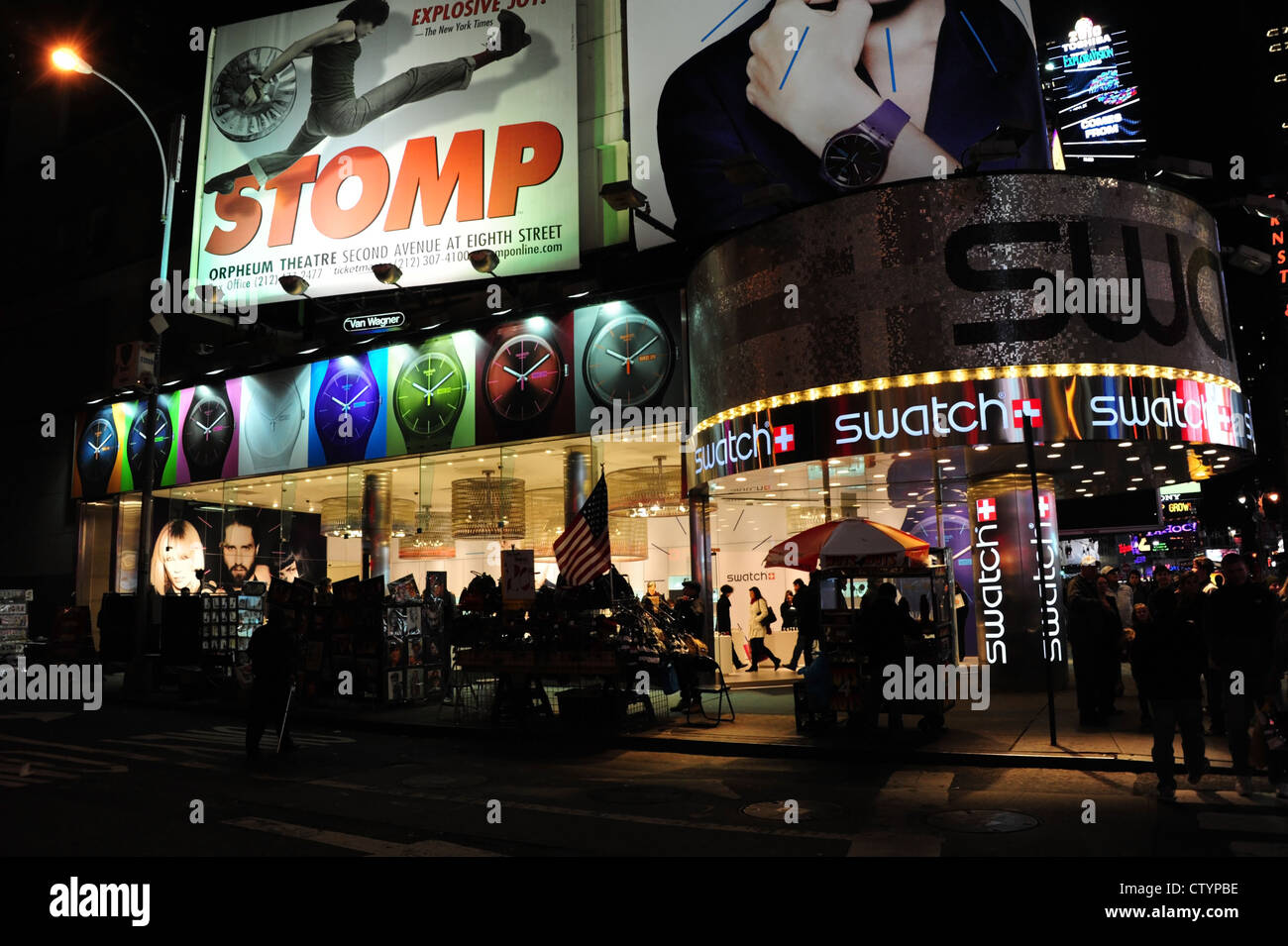 Night neon electric lights shop windows entrance Swatch Store and