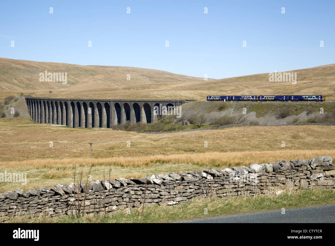 Northern Rail train crossing the famous Ribblehead viaduct on the Settle and Carlilse railway line, Ribblehead, North Yorkshire. Stock Photo