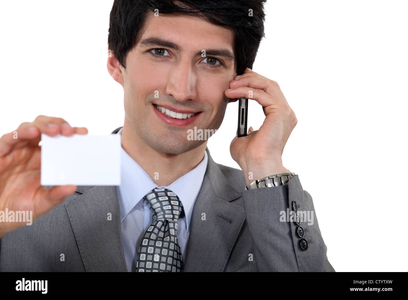 Executive holding a blank business card Stock Photo