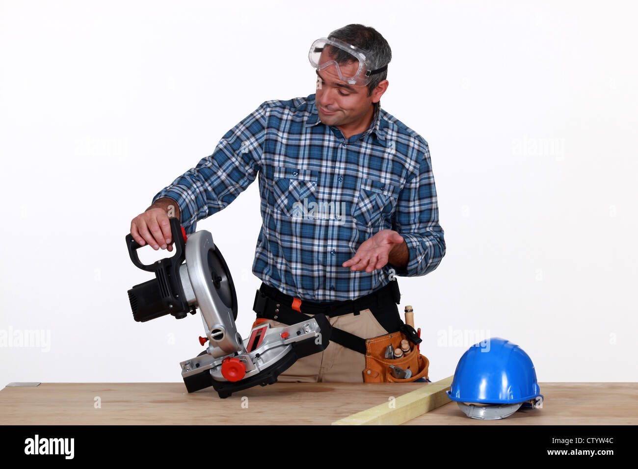 Man using industrial saw Stock Photo - Alamy
