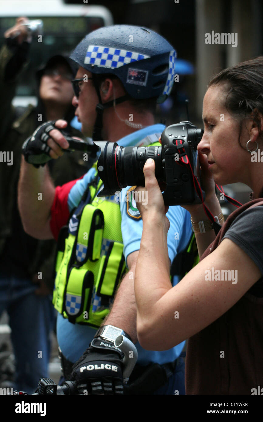 Police Officer and Camera crew, APEC, Sydney, New South Wales, Australia 2007 Stock Photo