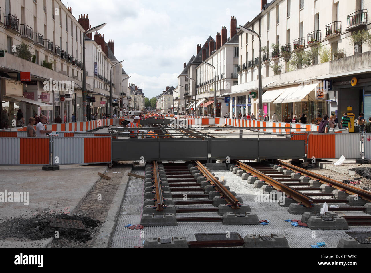 Workers Installing new tram lines or tramway within the French city of Tours. Stock Photo