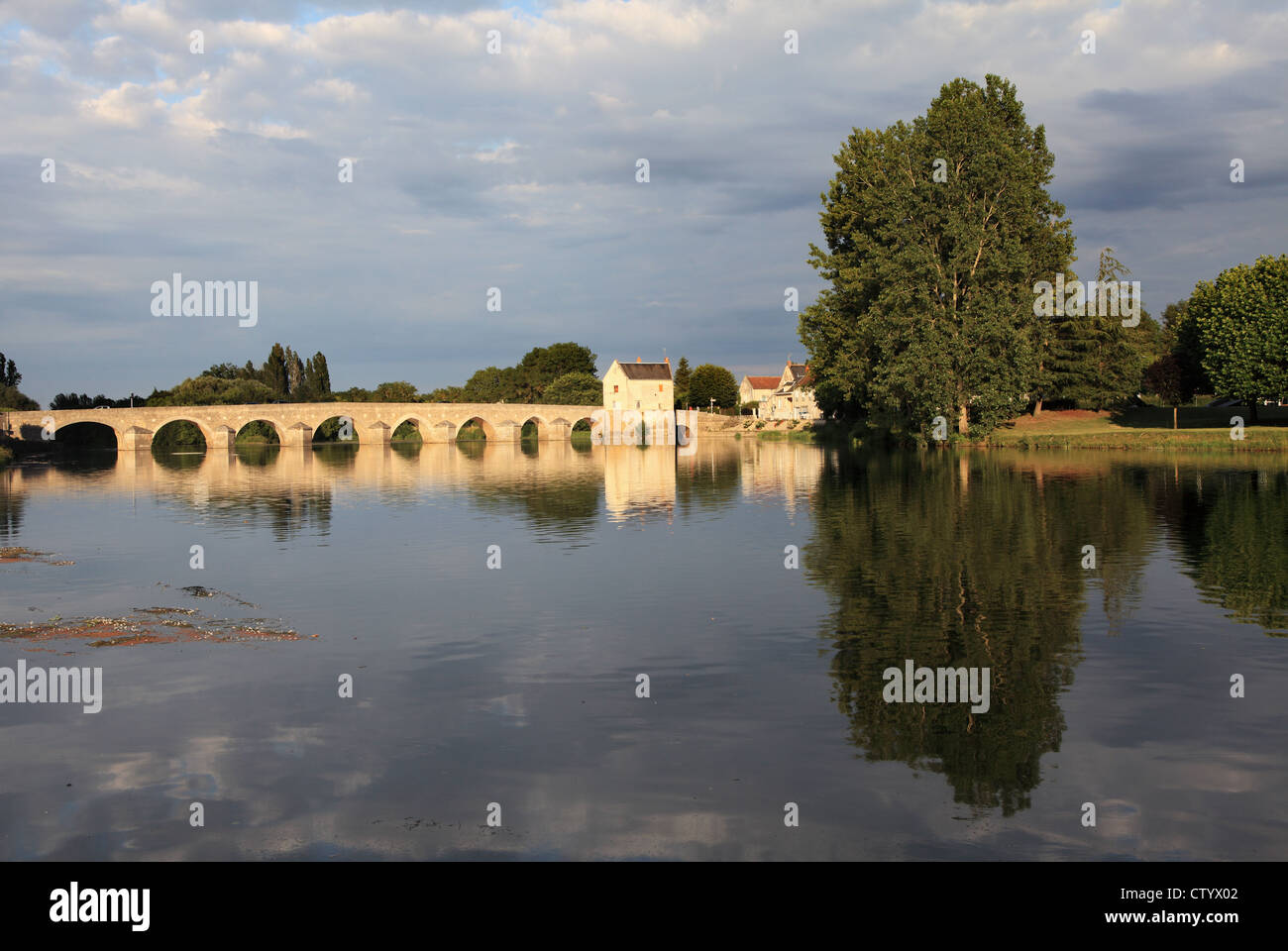 The bridge over the river Cher at Montrichard sur Cher seen in warm evening light, France. Stock Photo