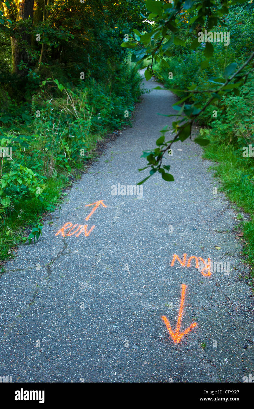 Run markings on path for Triathlon race Stock Photo Alamy