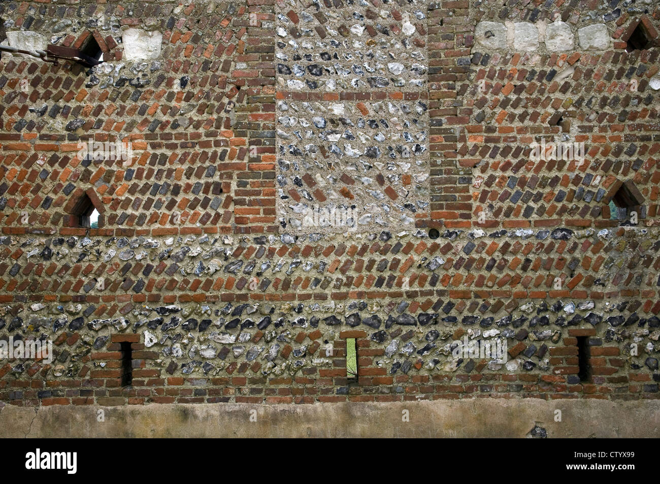 Mixed brick and stonework wall at the old Rathfinny farmhouse near Alfriston, East Sussex, UK Stock Photo