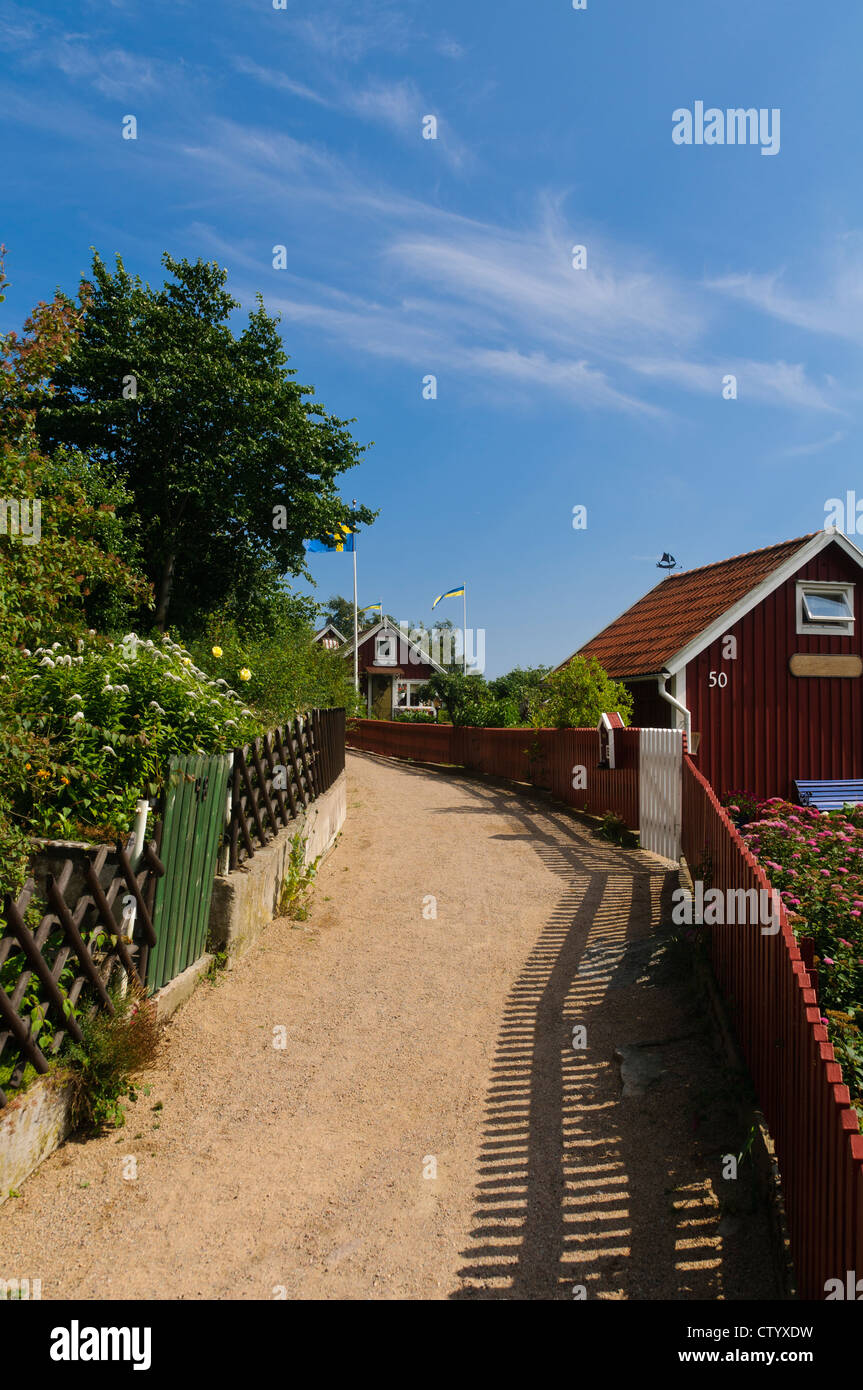 Swedish cottages painted in the typical 'Falun red' color in Brändaholm, Karlskrona county, Sweden Stock Photo