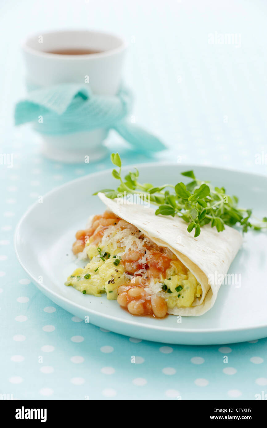 Plate of breakfast burrito with parsley Stock Photo - Alamy