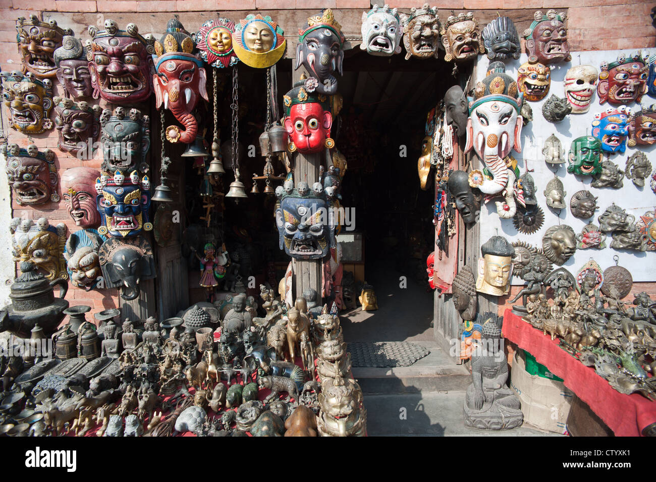 Masks, pottery,souvenirs, hanging in front of the shop, Bhaktapur, Nepal Stock Photo