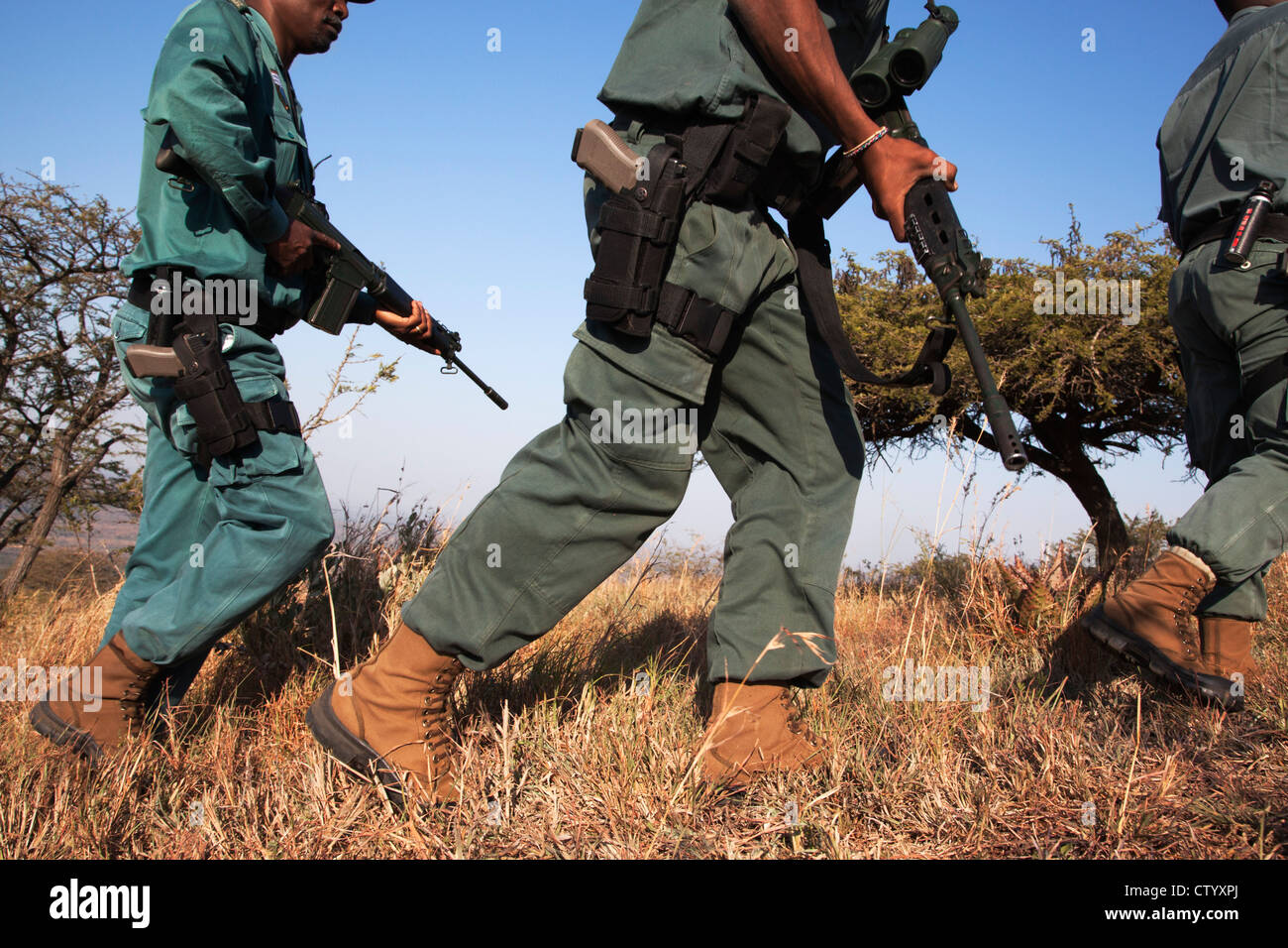 Anti-poaching unit on patrol in the bush, Ezemvelo KZN Wildlife, iMfolozi game reserve, South Africa Stock Photo