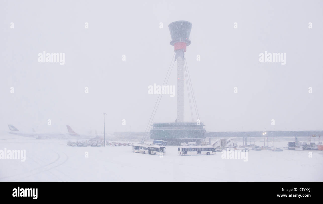 Air control tower and airport in snow Stock Photo