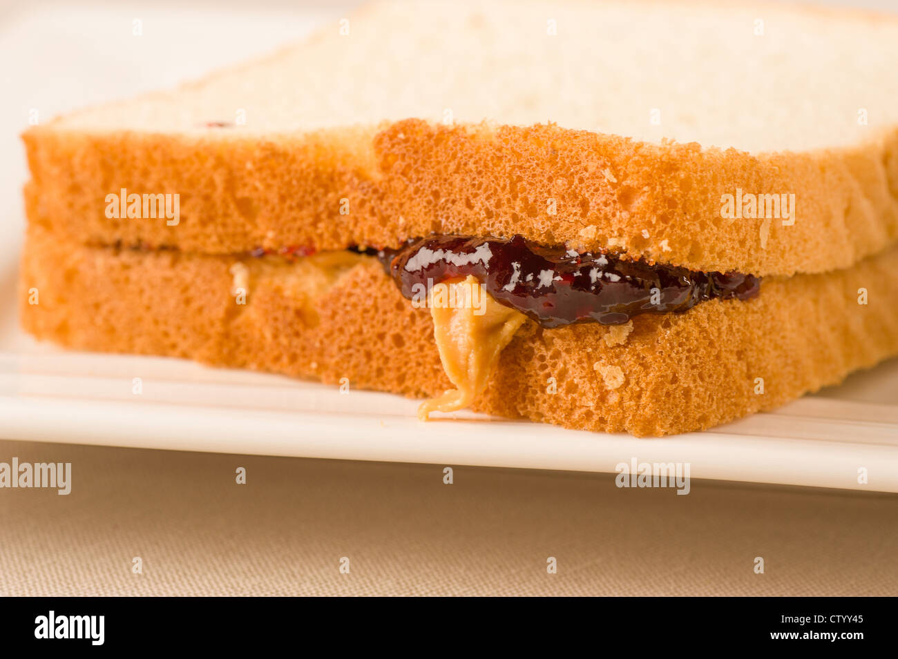 Peanut butter and jam dripping out of a sandwich Stock Photo Alamy