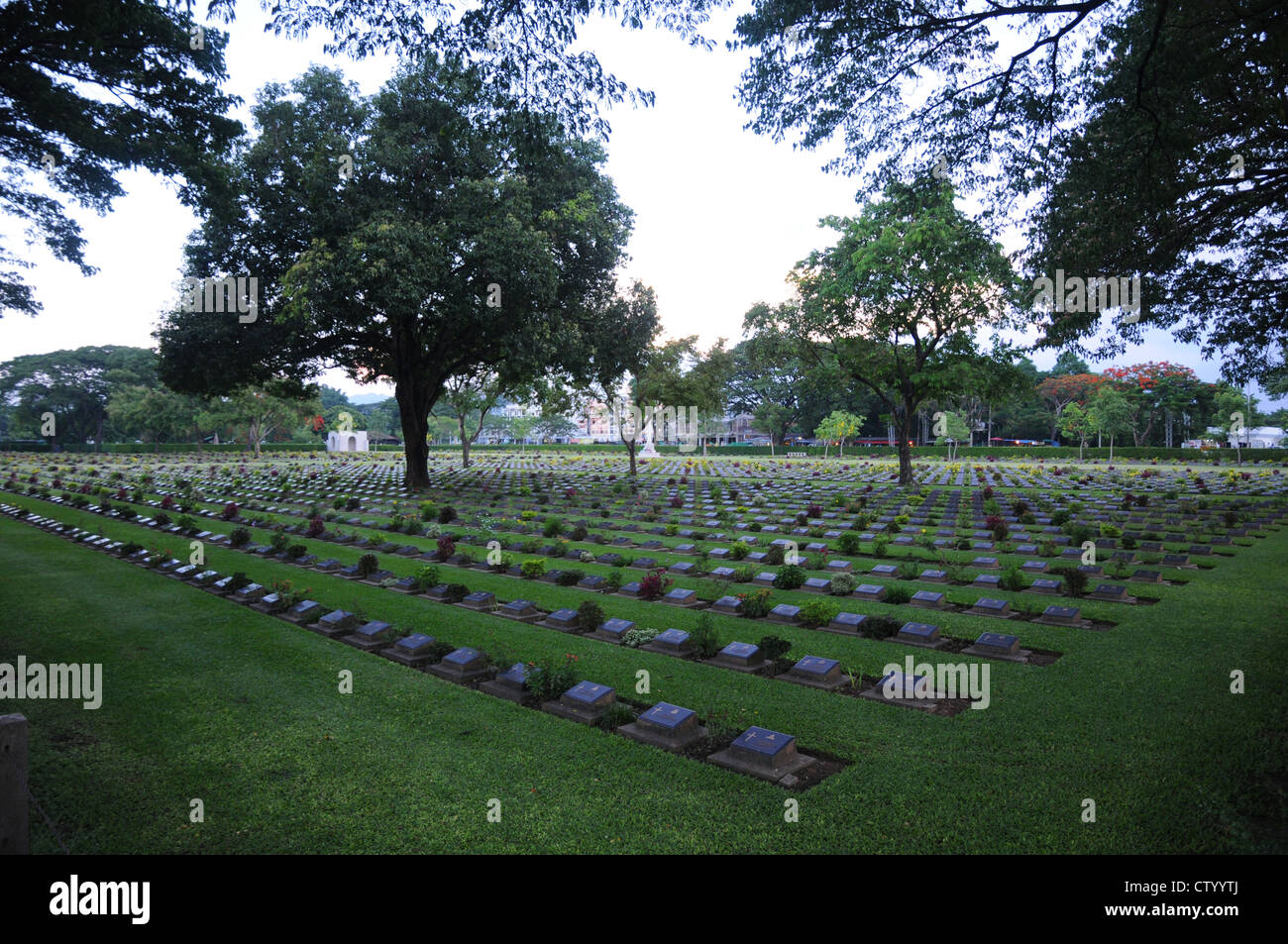 Allied war cemetery, clean, well cared for, green grass, trees, Kanchanaburi, Thailand. Stock Photo