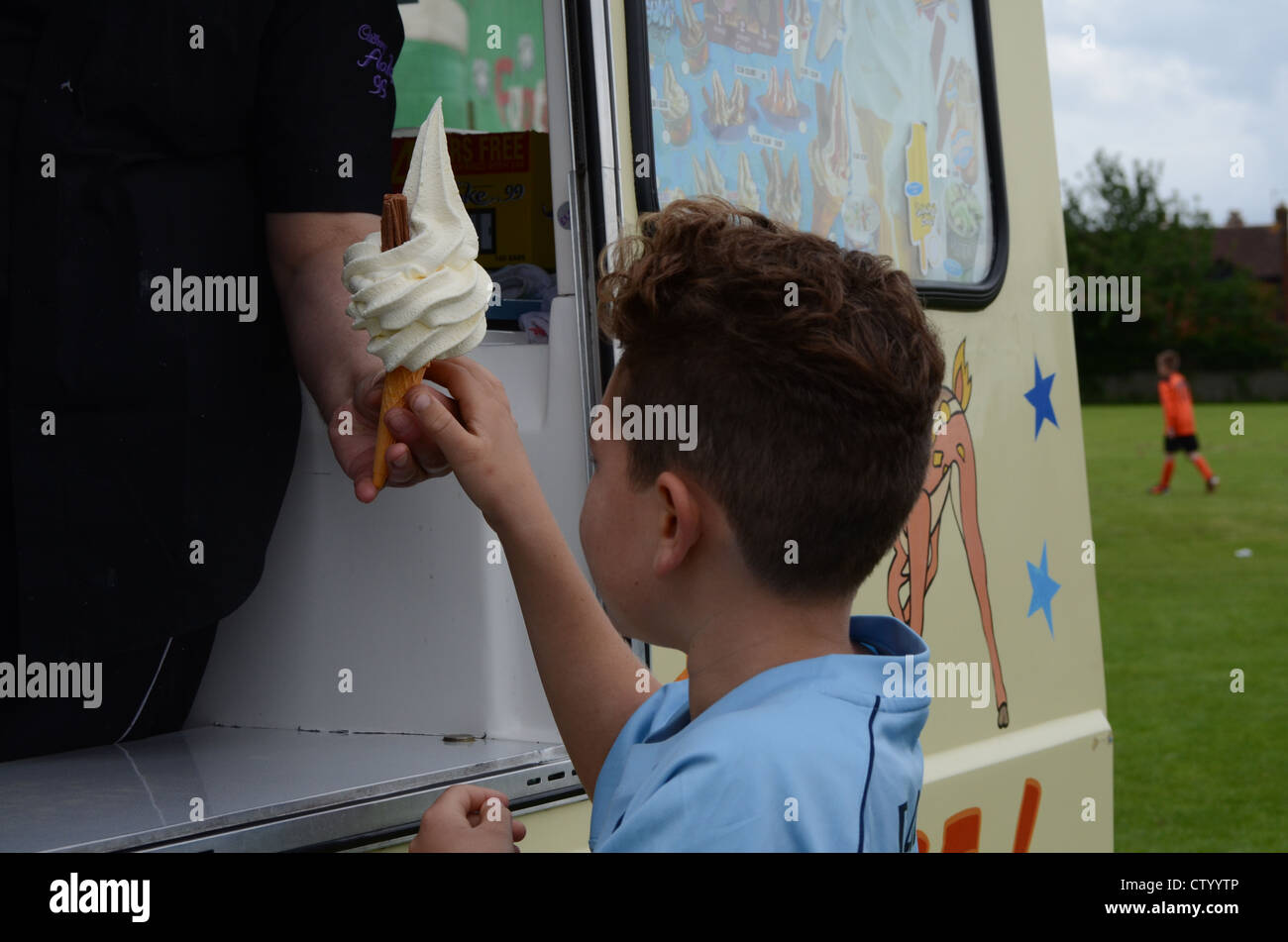 Boy buying ice cream from ice cream van Stock Photo Alamy
