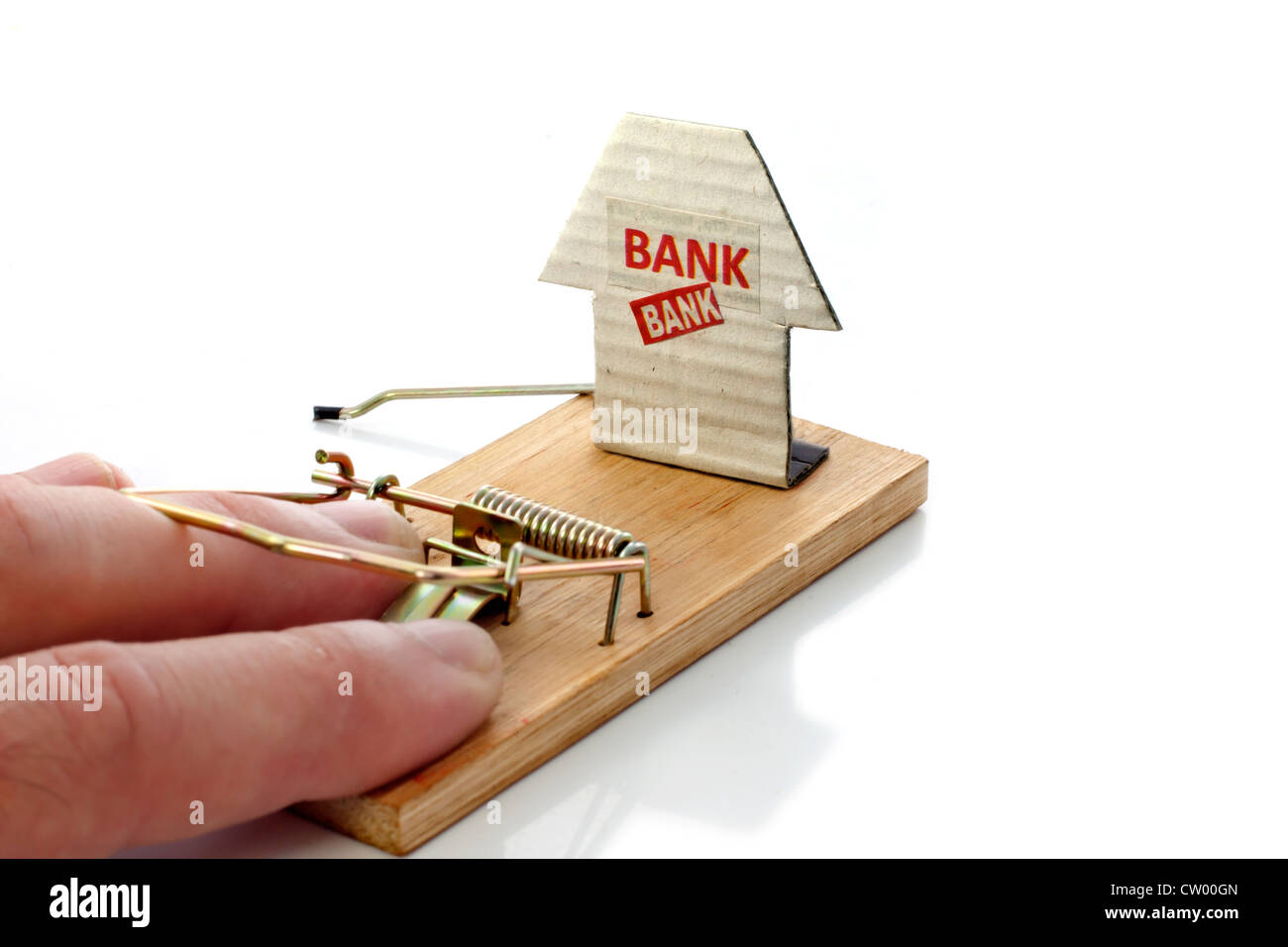 Hand of man caught in mousetrap set by the bank Stock Photo