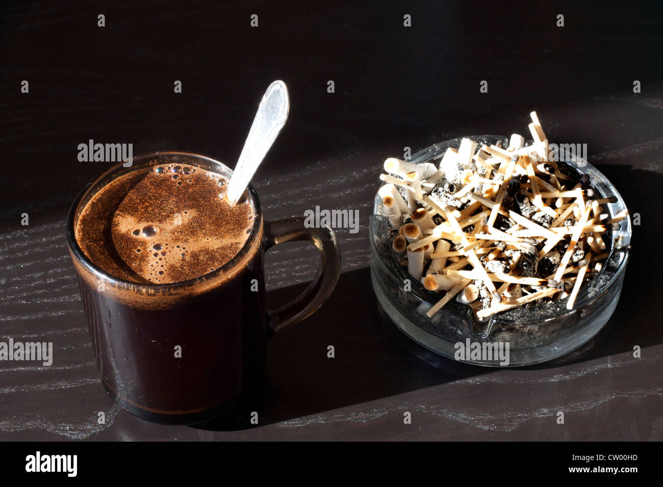 Coffee and cigarettes unhealthy habit in the morning Stock Photo