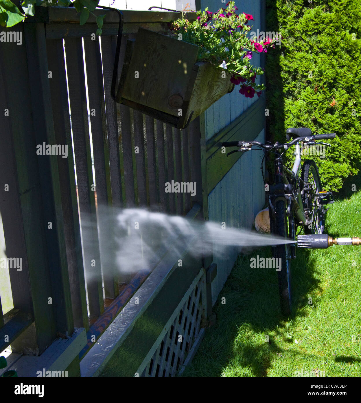 Pressure washing railing with oscillating  attachment Stock Photo