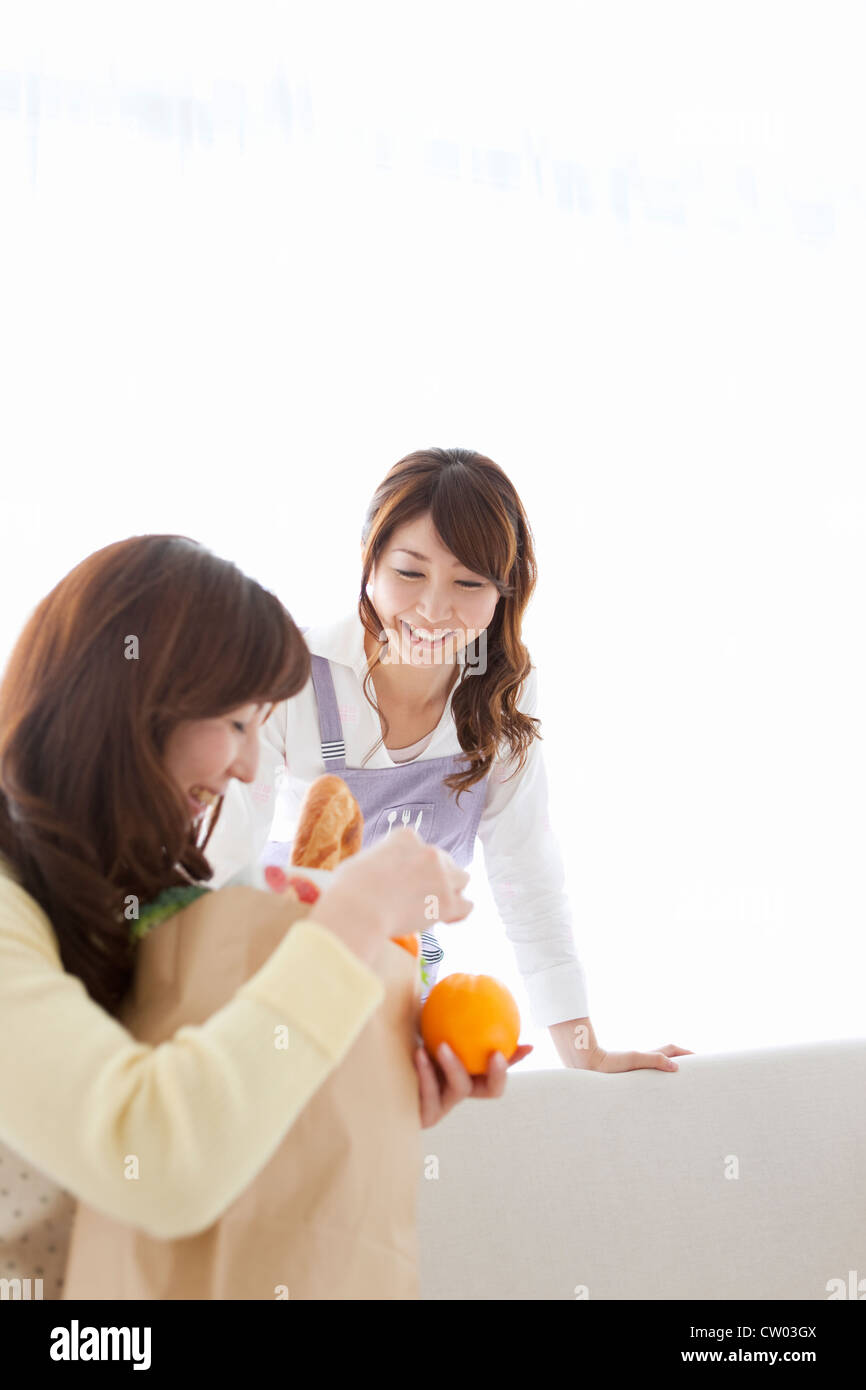 Two women talking smiling hi-res stock photography and images - Alamy