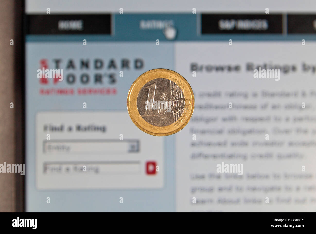 A one Euro coin with the Standard & Poor's credit rating agency web