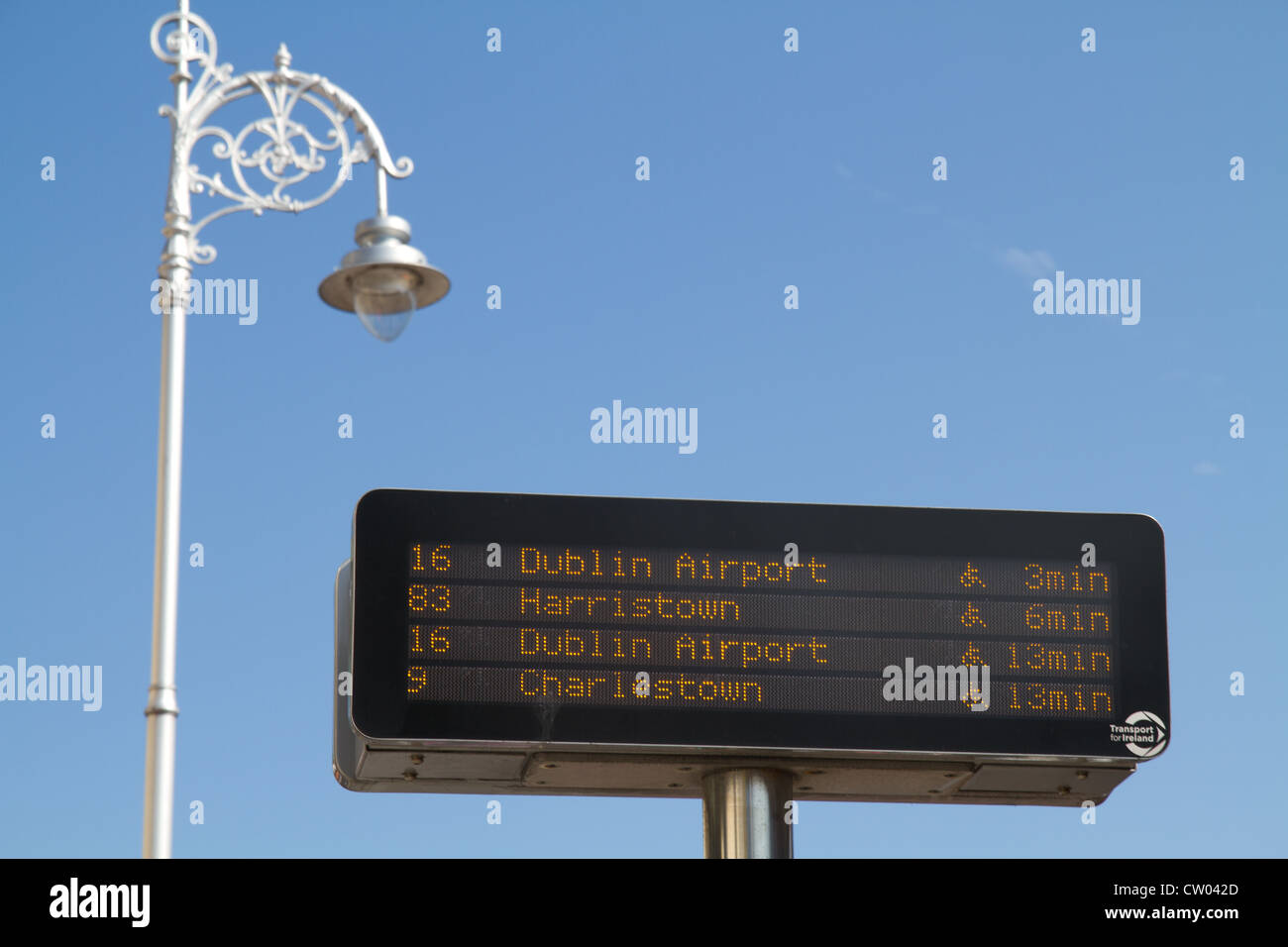 Digital bus time signpost in Dublin Ireland Stock Photo