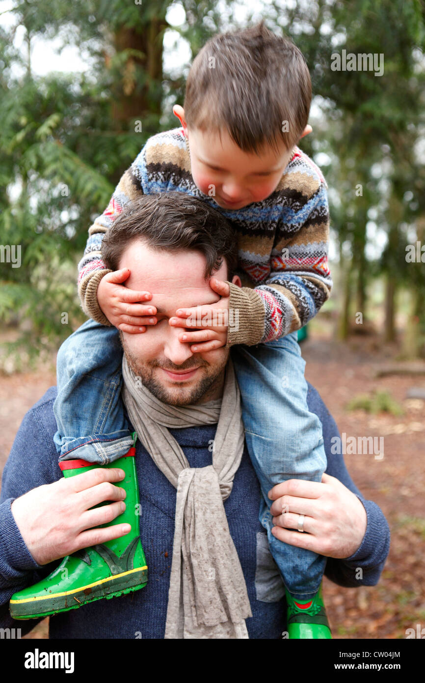 Father carrying son on shoulders Stock Photo