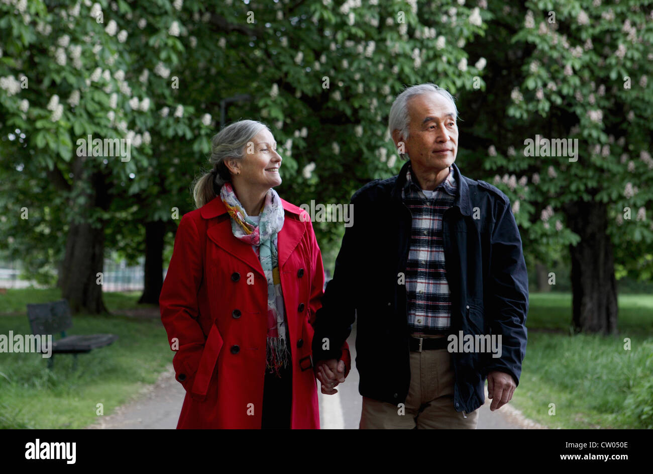Older couple walking in park Stock Photo - Alamy