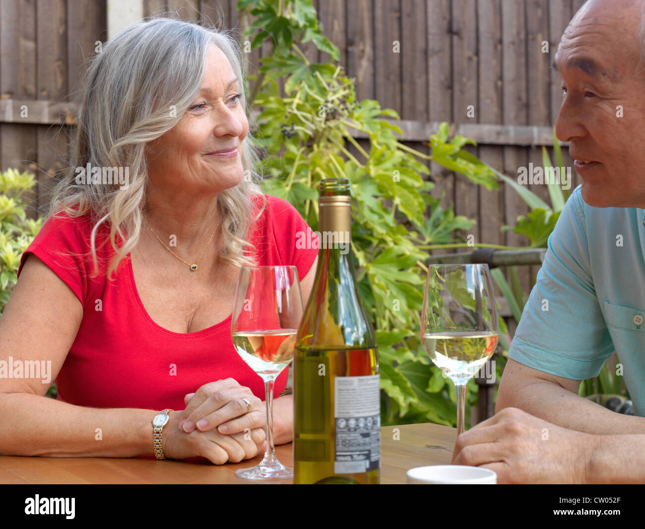 Older couple drinking wine together Stock Photo - Alamy