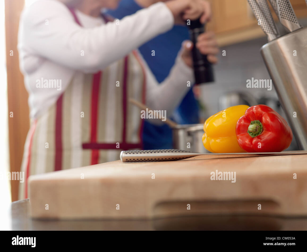 Close up of peppers on cutting board Stock Photo - Alamy