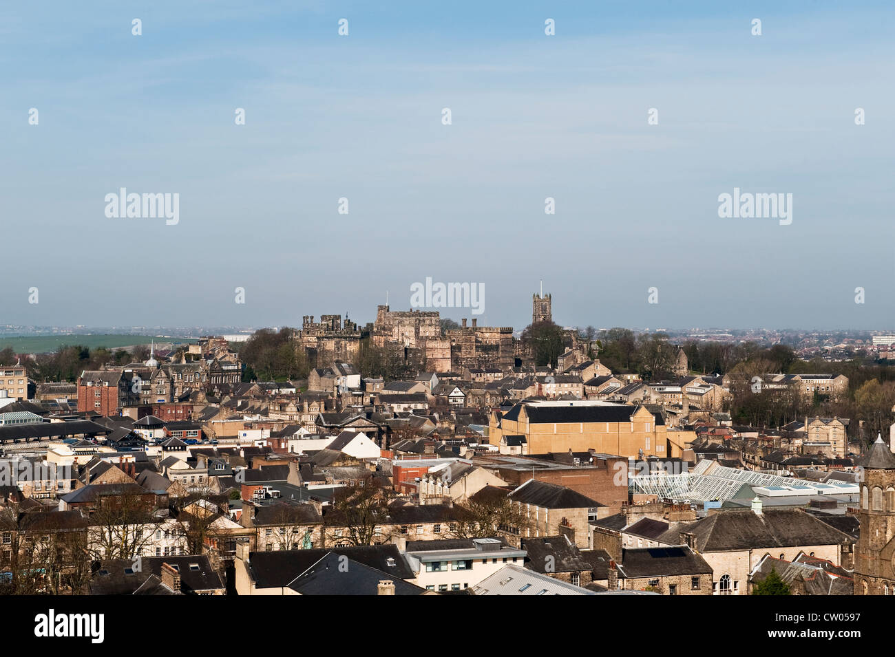 View over the city of Lancaster, UK, seen from the tower of St Peter's Cathedral, with the old prison of Lancaster Castle in the background Stock Photo