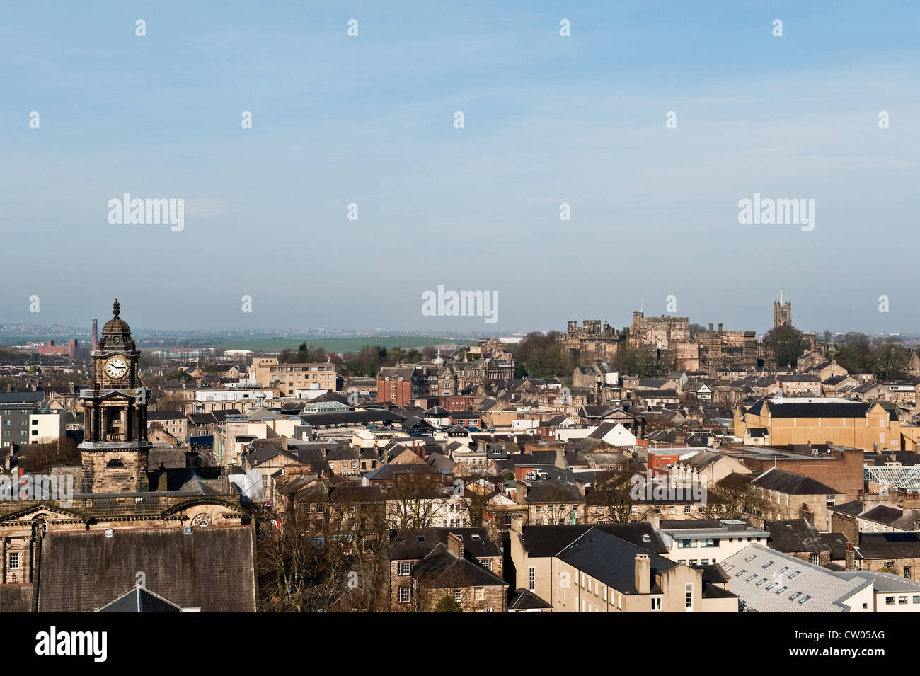 View over the city of Lancaster, UK, seen from the tower of St Peter's Cathedral, with the old prison of Lancaster Castle in the background Stock Photo