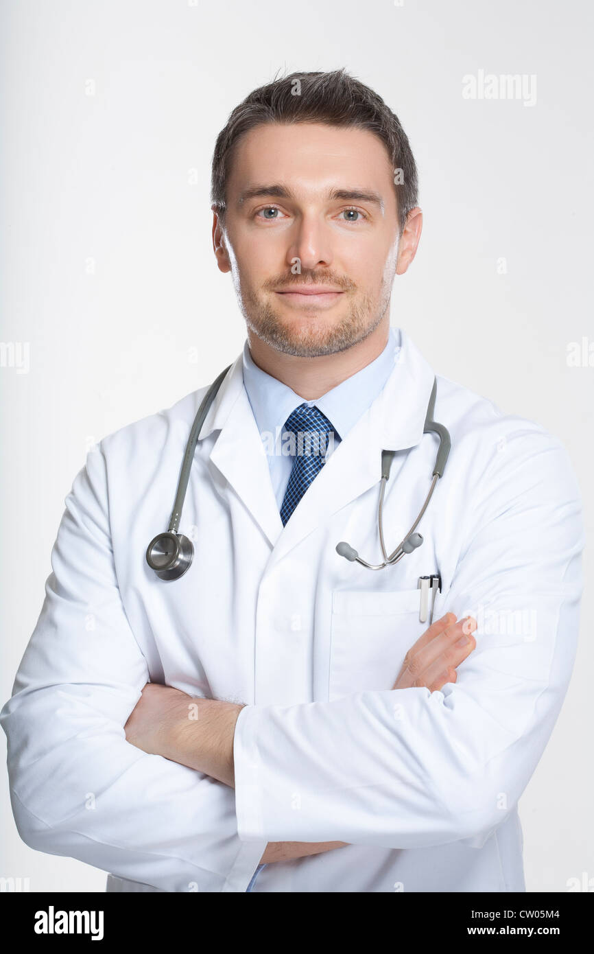 Doctor standing with crossed arms Stock Photo