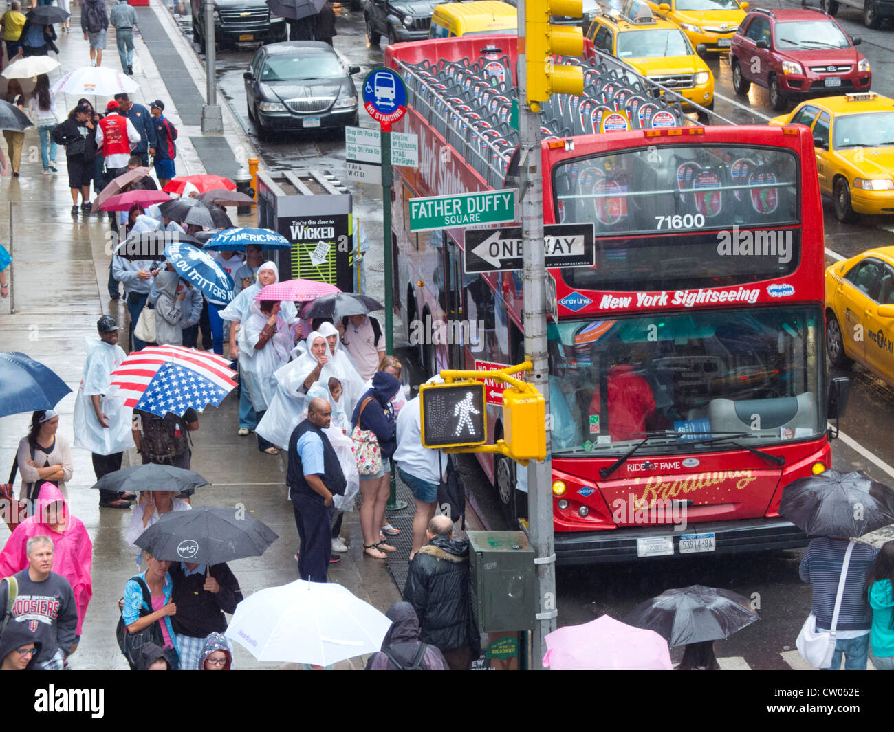 tourists getting on bus in Times Square Stock Photo Alamy