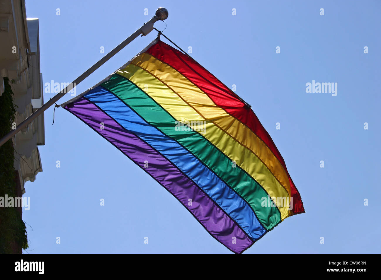 A Gay Pride Flag hanging from the side of a building in Montreal, Quebec Stock Photo
