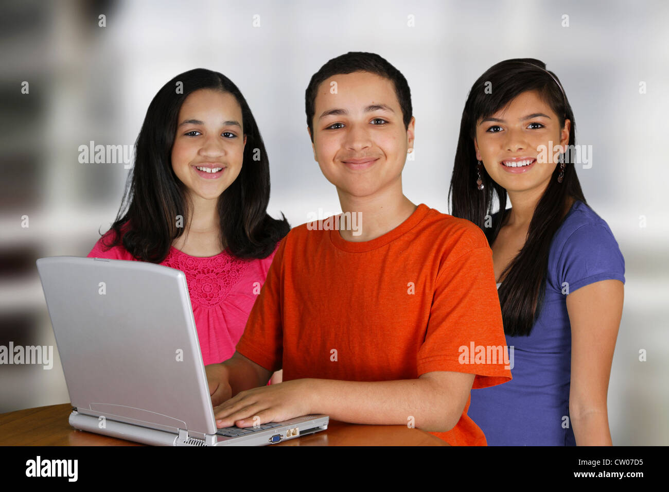 Group of children using a computer at school Stock Photo - Alamy
