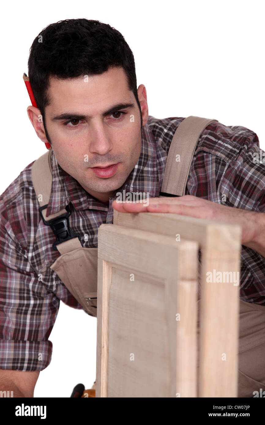 Carpenter building a cupboard Stock Photo Alamy