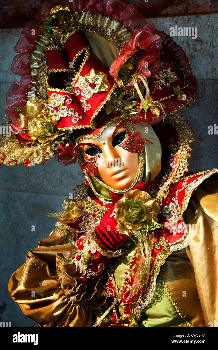 red and gold costume at venice carnival celebration Stock Photo - Alamy