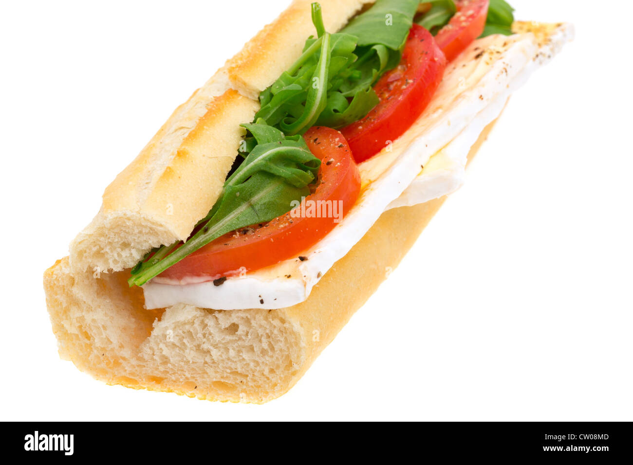 French Baguette filled with brie cheese, sliced tomato and lettuce - studio shot with a white background Stock Photo