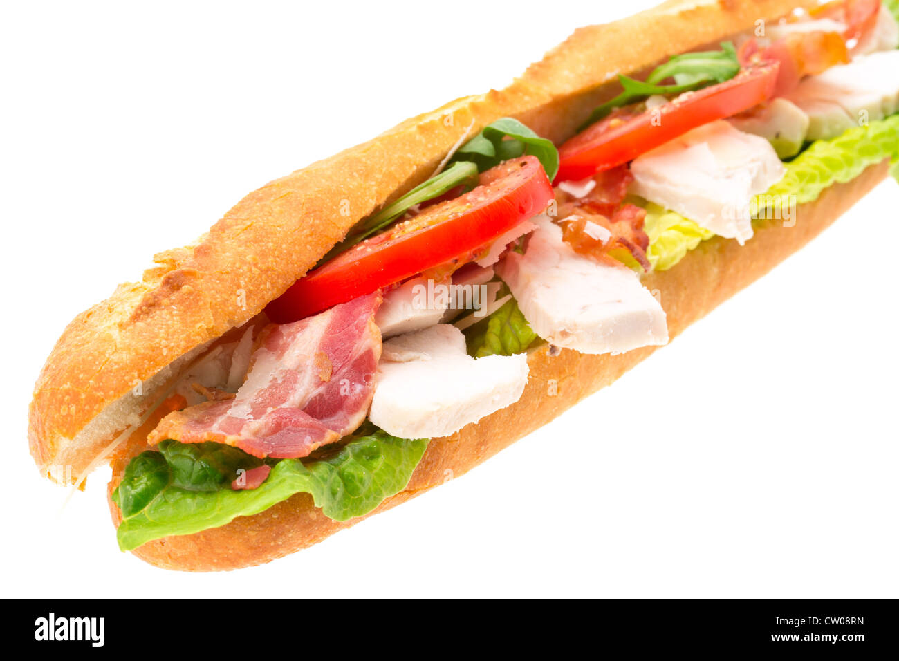 Chicken, bacon and salad filled baguette served on a white plate - studio shot with a white background Stock Photo