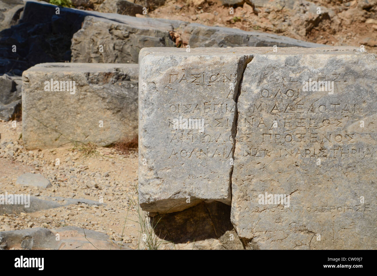 A stone block that was found at the Acroplis at Lindos with an ancient Greek inscription, Rhodes, Greece. Stock Photo
