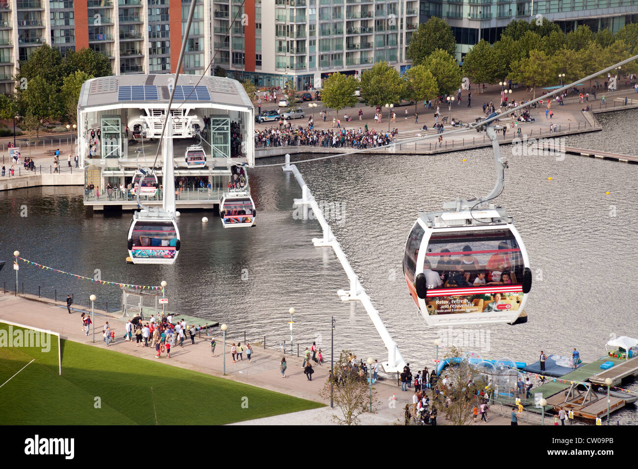 The Emirates Air Line cable car approaching the Royal Docks terminal, River Thames London UK