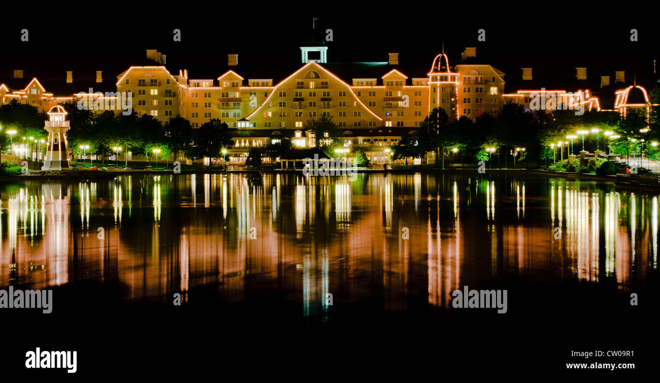 Disney Newport Bay Hotel, Disneyland Paris, Reflected In The Lake At Night Stock Photo