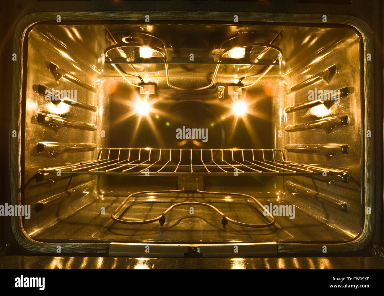 Inside of a convection electric oven showing energized heating coils