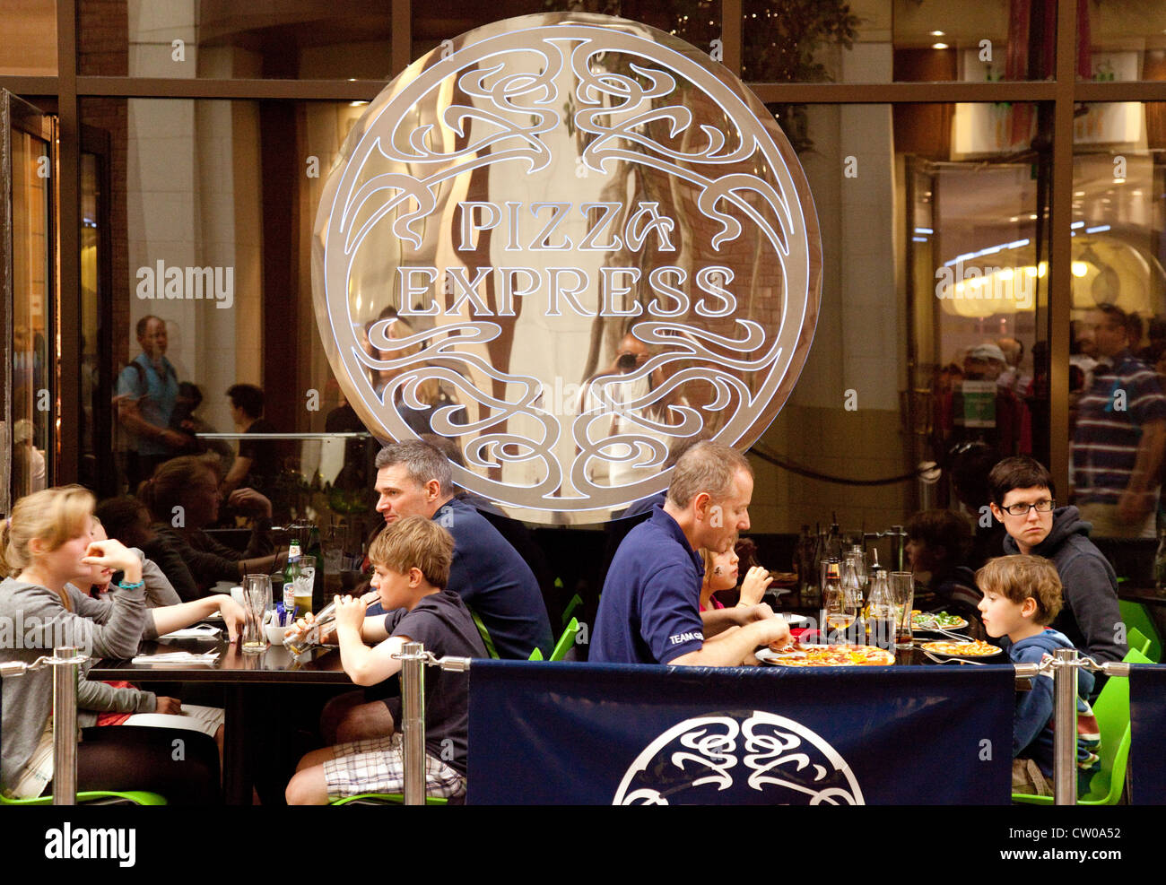 People eating a meal at Pizza express restaurant O2 arena, london UK Stock Photo
