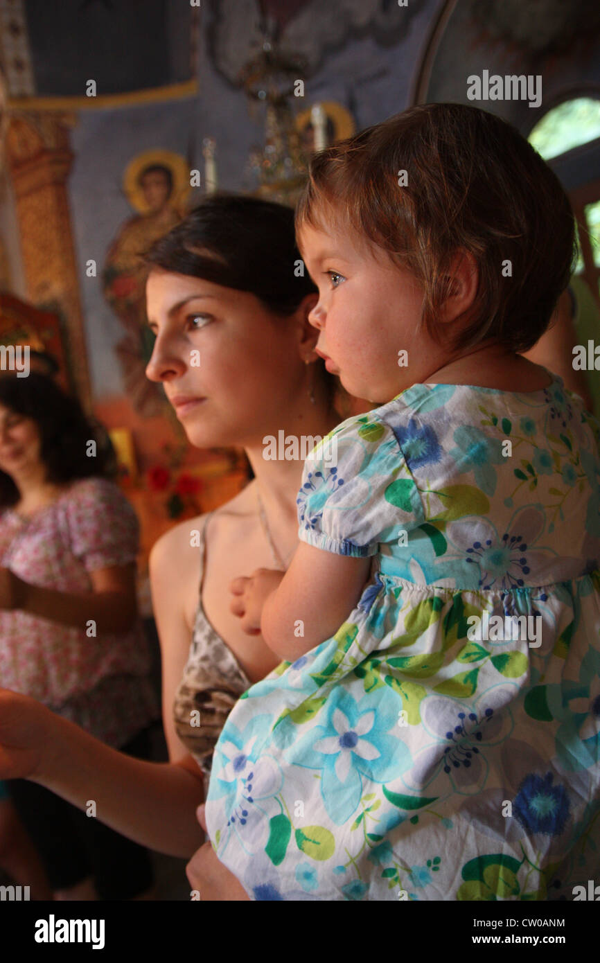 Mother and daughter in Bulgarian church Stock Photo