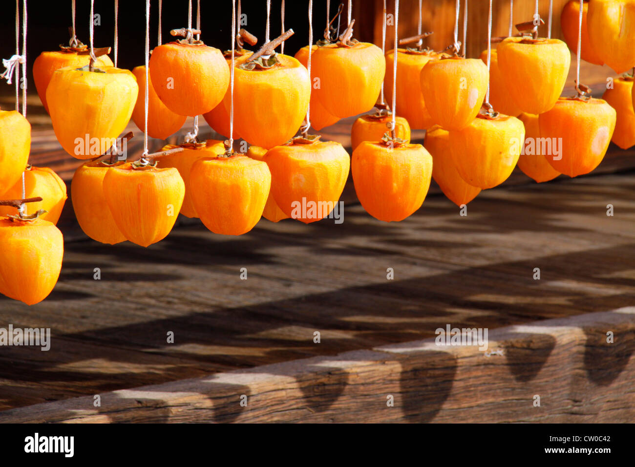 Drying pealed persimmon fruit to make Korogaki Yamanashi Japan Stock ...