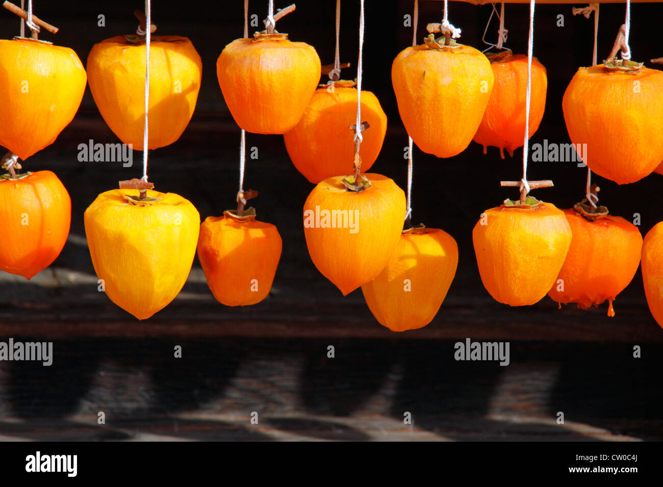 Drying pealed persimmon fruit to make Korogaki Yamanashi Japan Stock ...