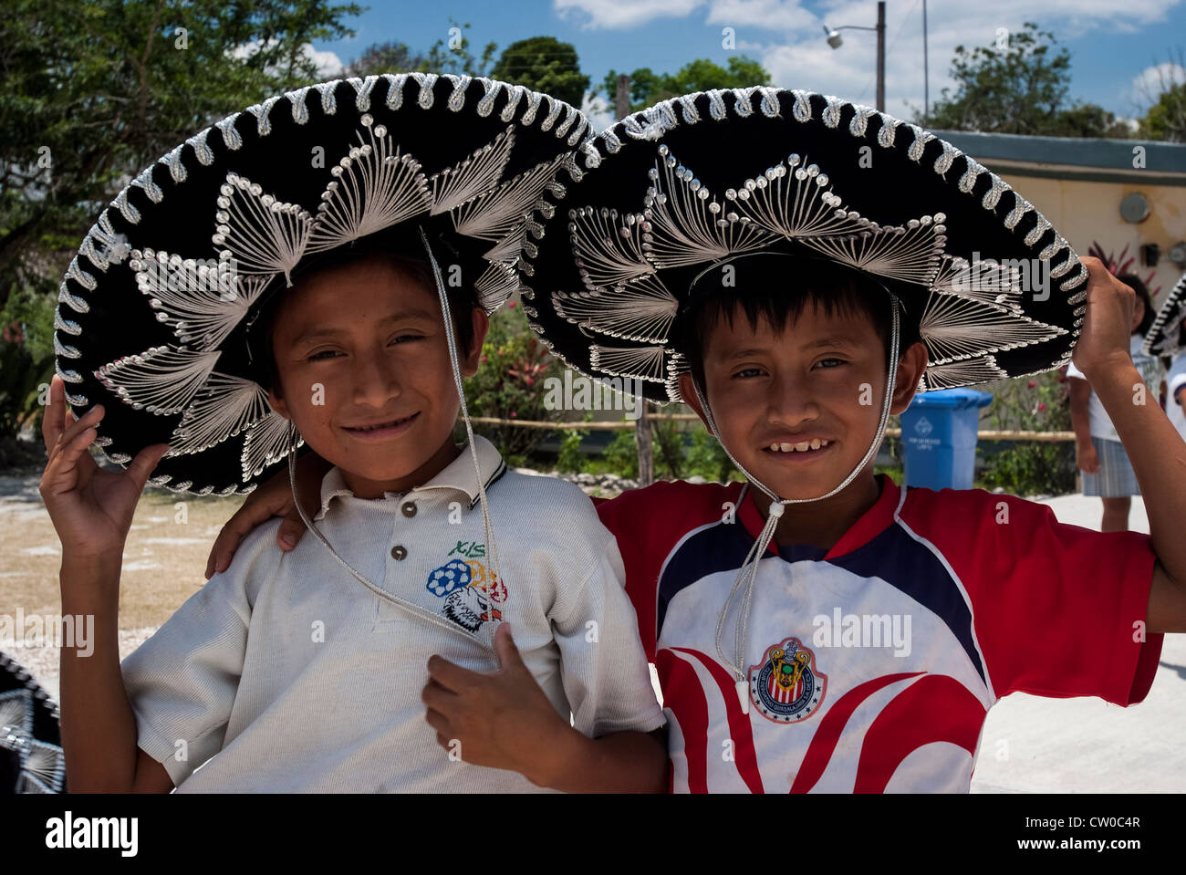 Two Mexican boys wearing traditional sombreros. Coba', Mexico. Stock Photo