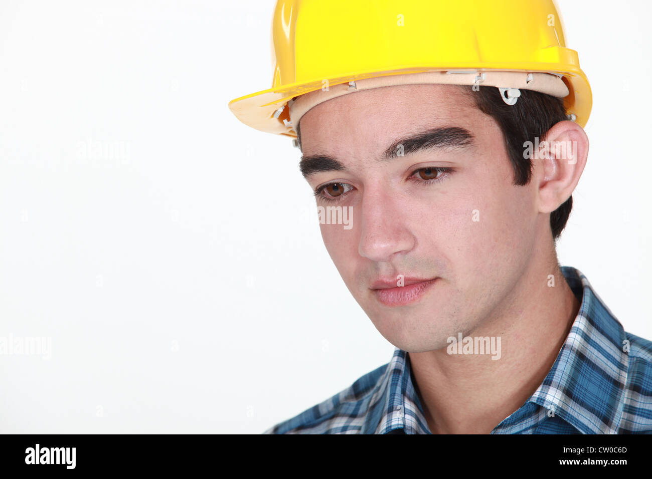 Young construction worker with a neutral expression Stock Photo